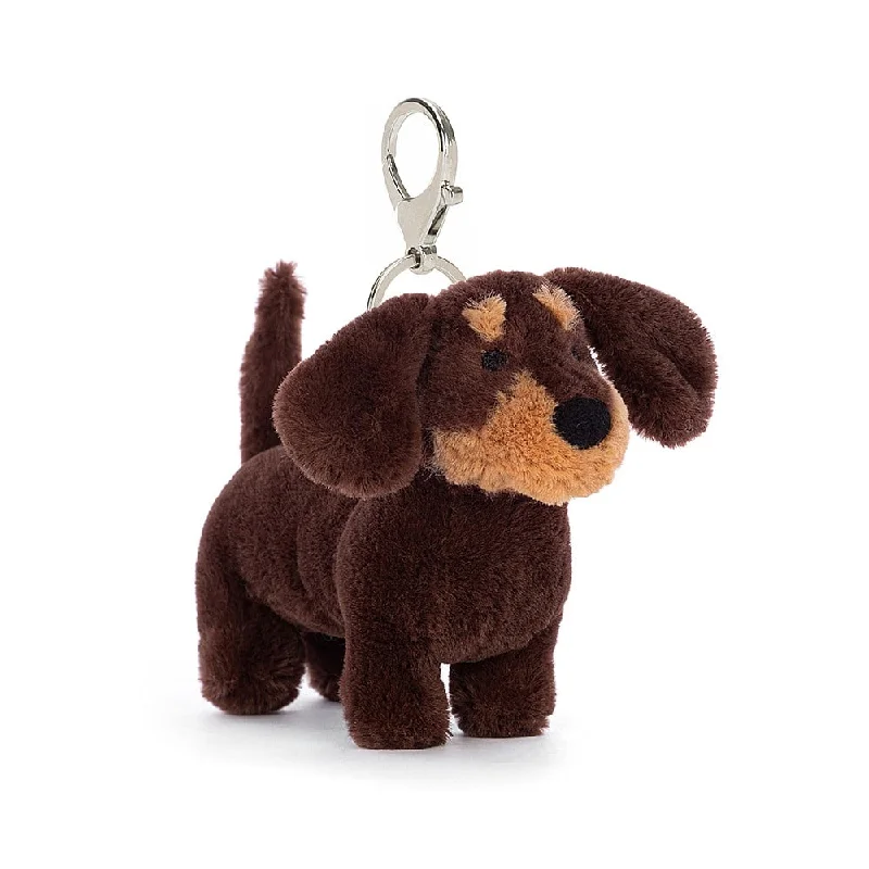 Cuddly and delightful Jellycat naptime buddiesJELLYCAT OTTO SAUSAGE DOG BAG CHARM BROWN 11X4X11CM